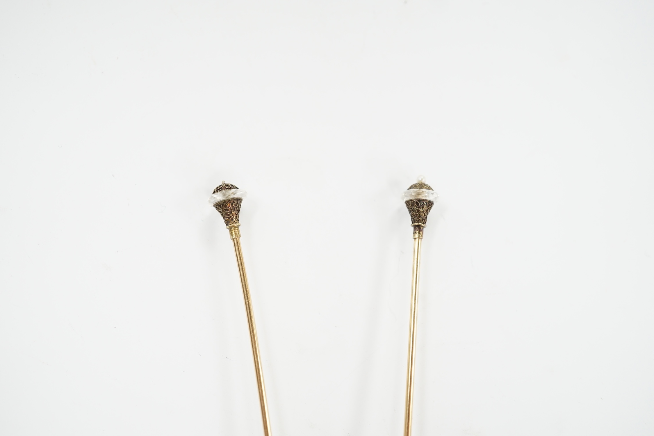 A pair of seed pearl set 'filled pin' hatpins, one a.f. 16cm.